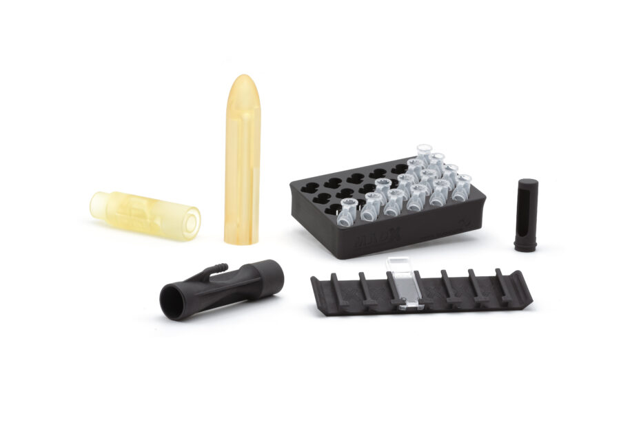 Various 3D printed components used for medical technology: valves, flow sensors and holders for test tubes.