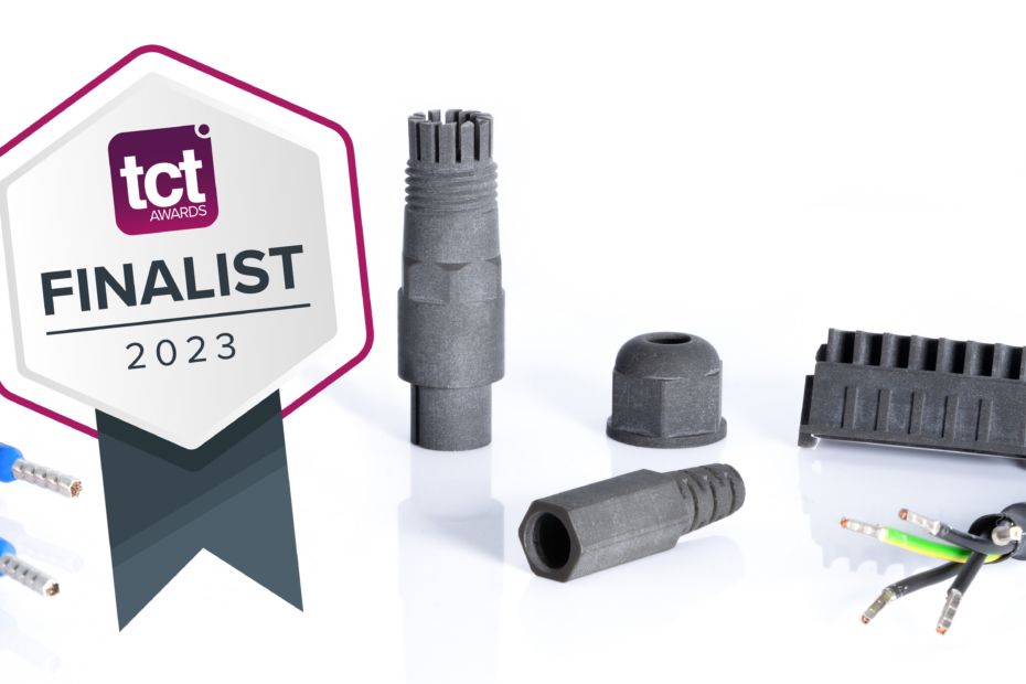 Different 3D printed black connectors on a white background. Two cables protrude into the image from the right and from the left. In the foreground, a graphic showing that the product is a finalist at the TCT Awards 2023.